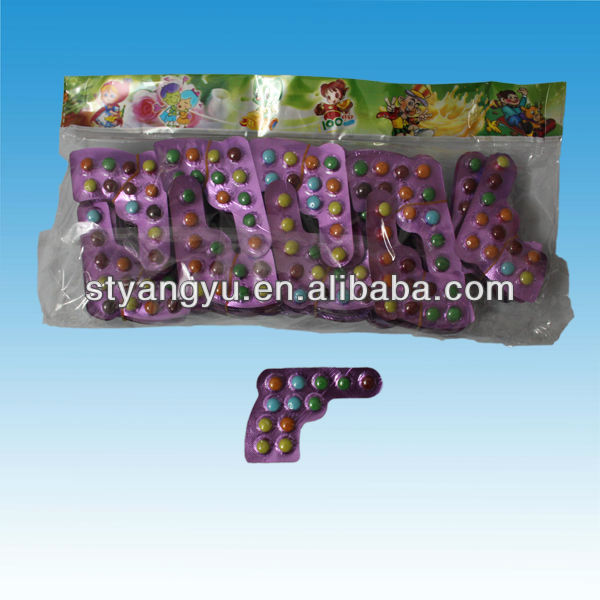 Colorful sugar coated chocolate bean with gun card pack