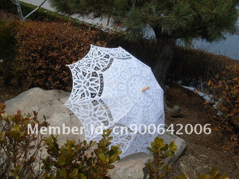 There are lace parasols in white 
