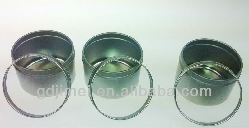 small round tin box with clear widow