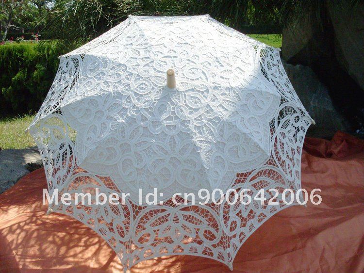 There are lace parasols in white 