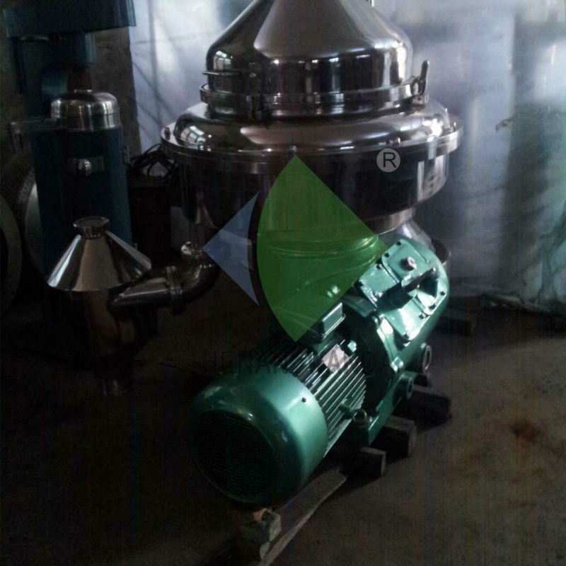 Two phase centrifuge/disc type oil water separator