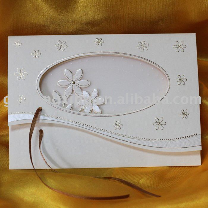 Wedding invitation card with oval window displaying shining jasmines tied 