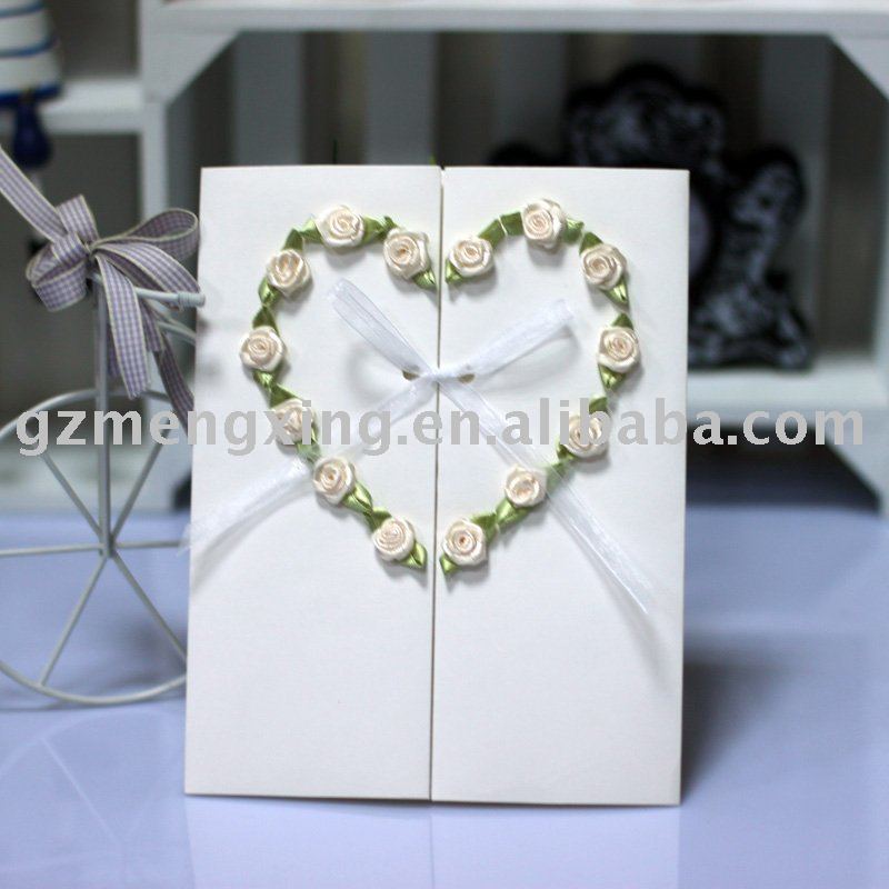 Elegant wedding invitation cards with a heart formed by 14 pieces of 