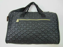 Featuring sweet heart shaped quilting and easy access pockets black Quilted Weekender bags carry on luggage