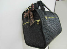 Featuring sweet heart shaped quilting and easy access pockets black Quilted Weekender bags carry on luggage