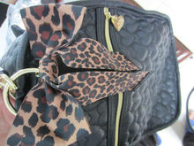Featuring sweet heart shaped quilting and easy access pockets black Quilted Weekender bags carry on luggage