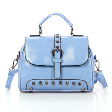 2014 The new sell like hot cakes women s handbag fashion personality rivet handbag messenger bag