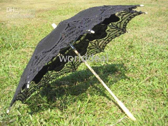 There are lace parasols in white black ivory and fans in whiteblack in 