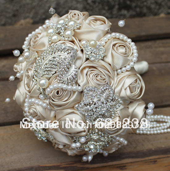Holding-champagne-wedding-flower-brooch-bouquet-includes-a-bridegroom-boutonniere-wrist-flowers.jpg